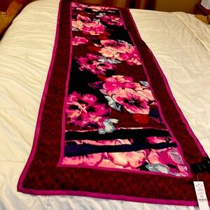 This is a Beautiful Scarf new with tags, I have two of them.